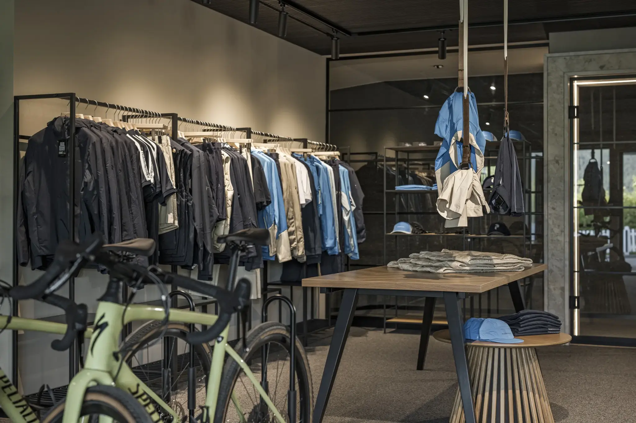 Sport Center with cycling apparel and a green Specialized bike in the bike shop of the Alpenresort Schwarz